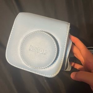 Baby Blue InstaX Polaroid camera , lightly used and still works perfectly!
